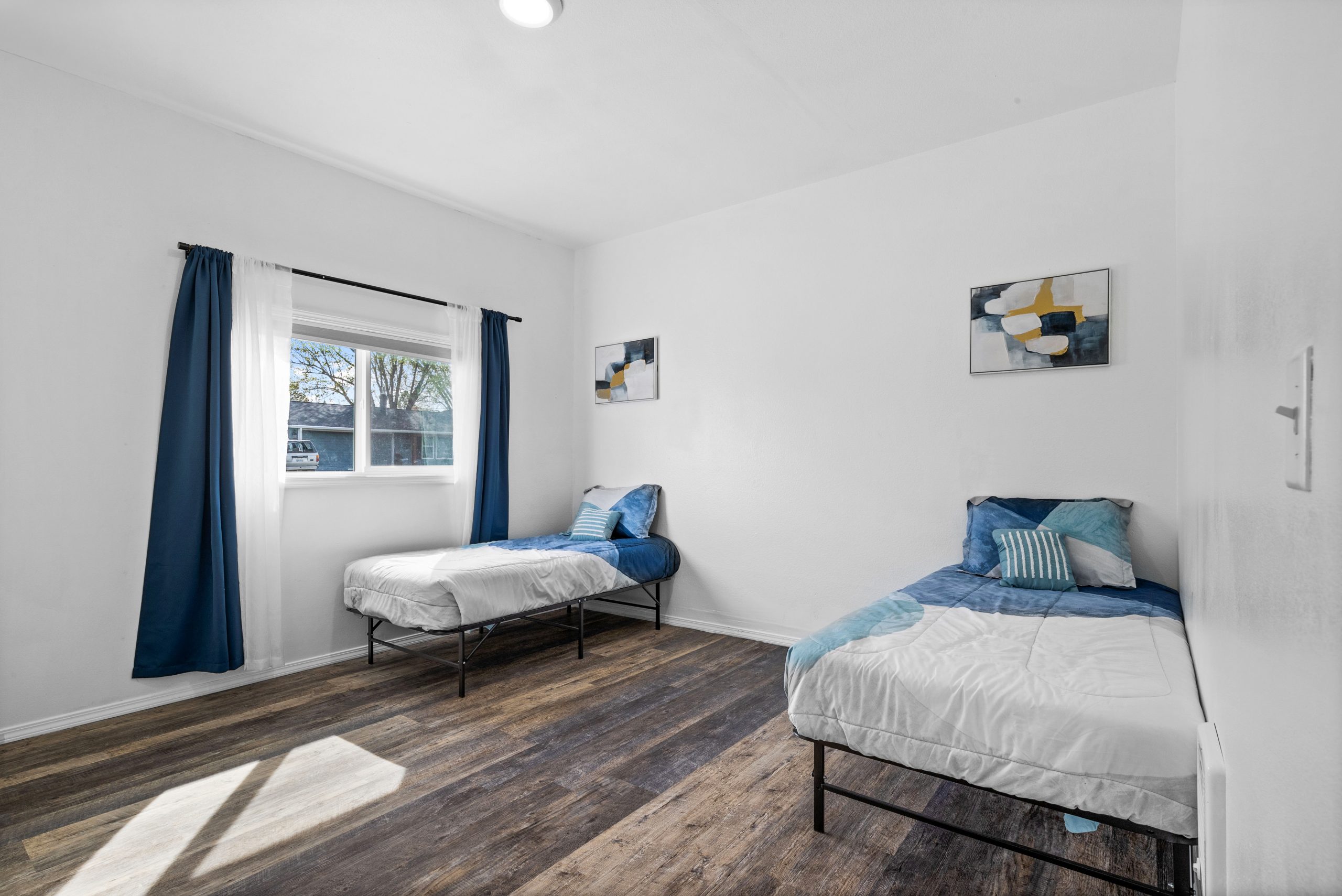 Shared bedroom with blue bedding at Clarkston Care Home