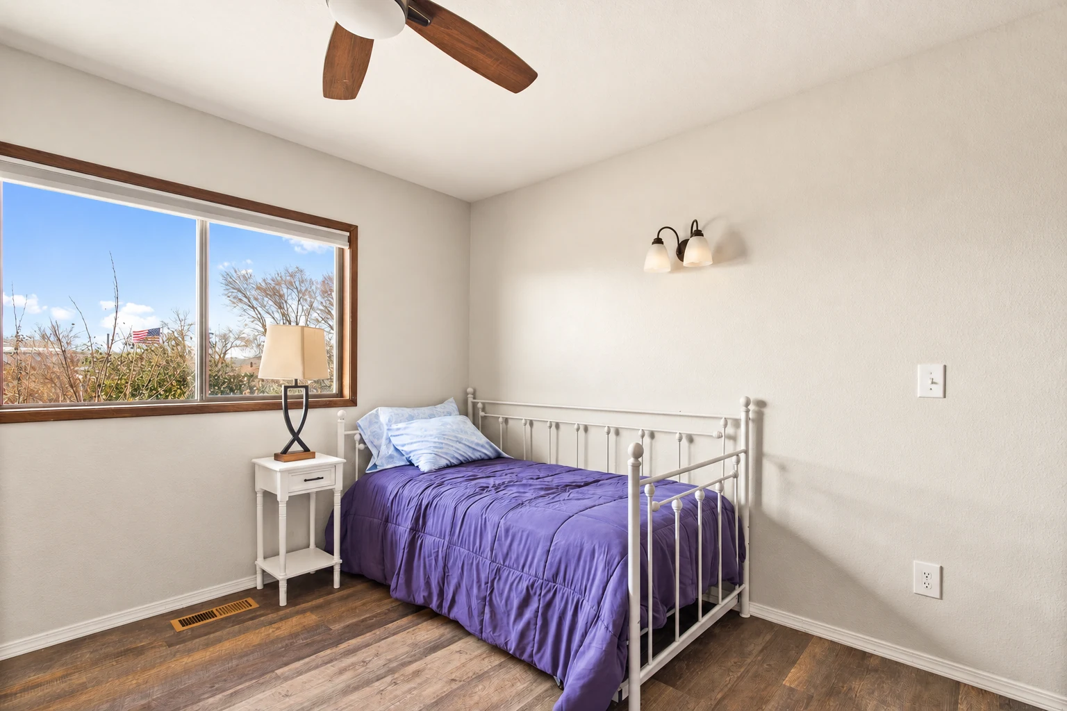 Bedroom with garden outlook at Clarkston Care Home — enhanced photograph